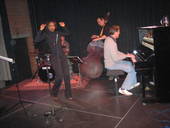Willetta Carson performs Summer Samba, latin jazz and swing at E-Werk, Erlangen. Onstage camera shot with musicians at piano, bass and drums.